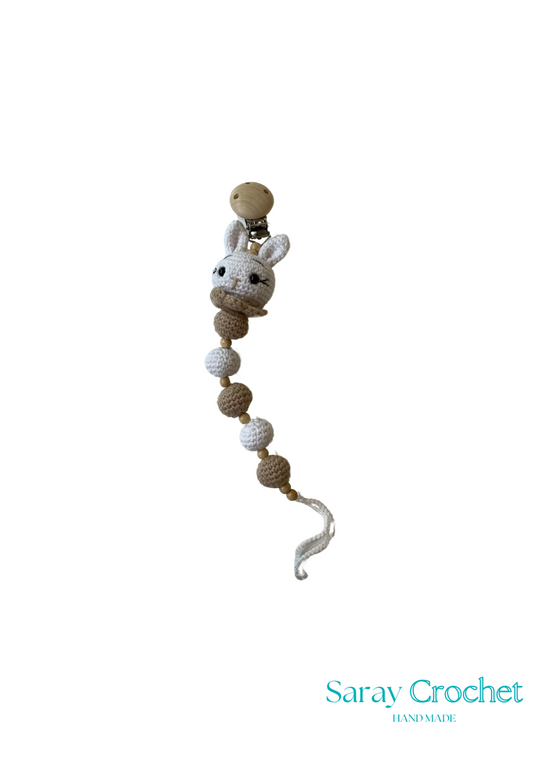 Crocheted baby rattle with bunny design on a white background, branded 'Saray Crochet'.