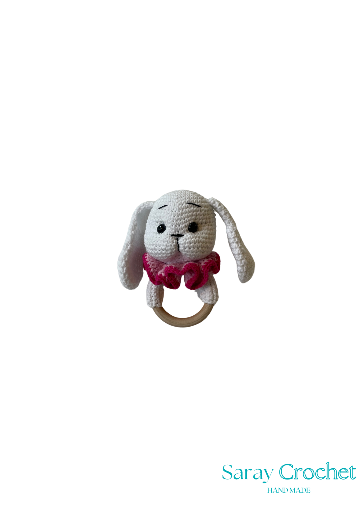 Crocheted bunny rattle with pink bow on a white background, branded 'Saray Crochet'.