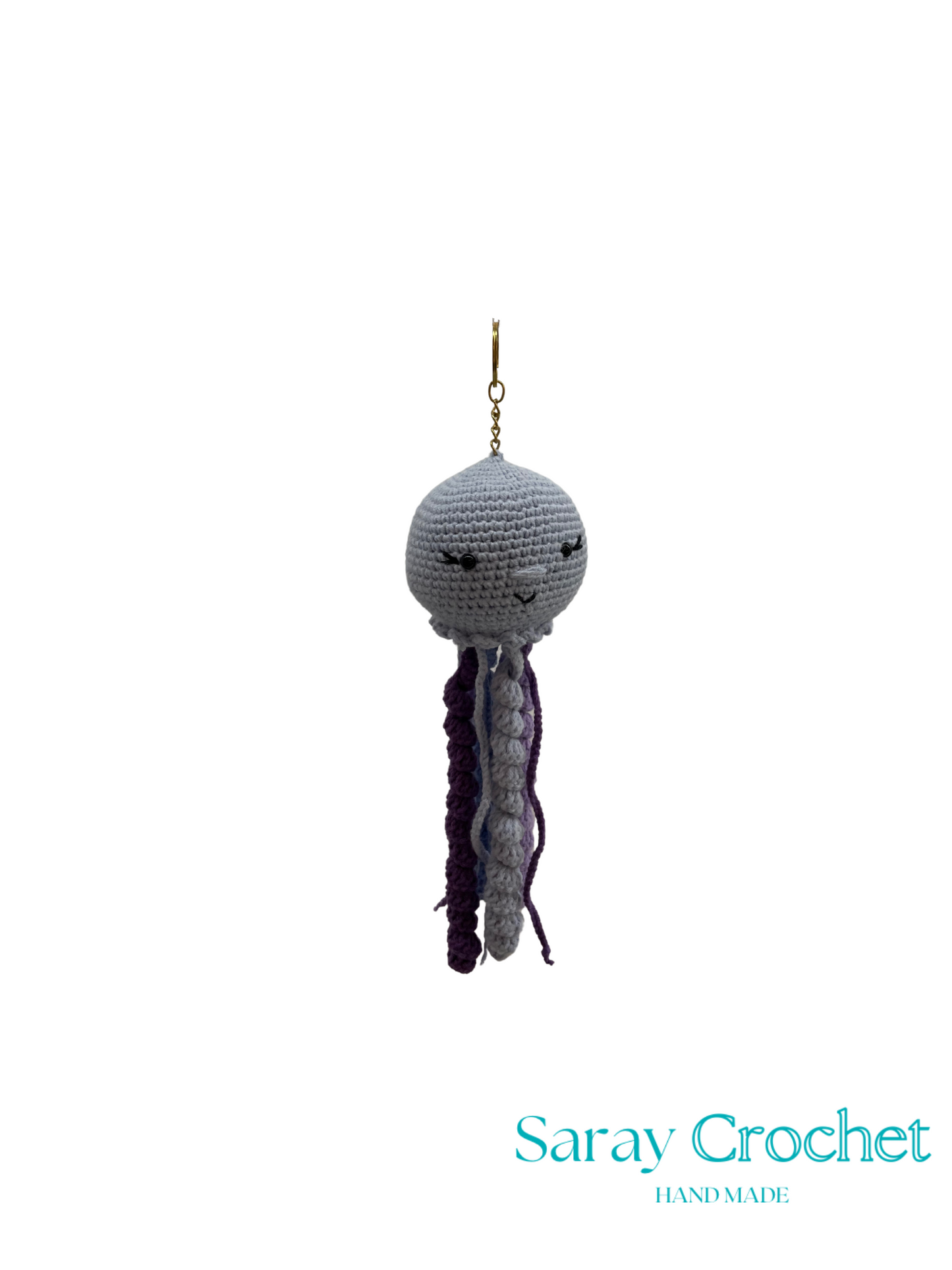 Crocheted jellyfish ornament with a gold chain on a white background, branded 'Saray Crochet'.