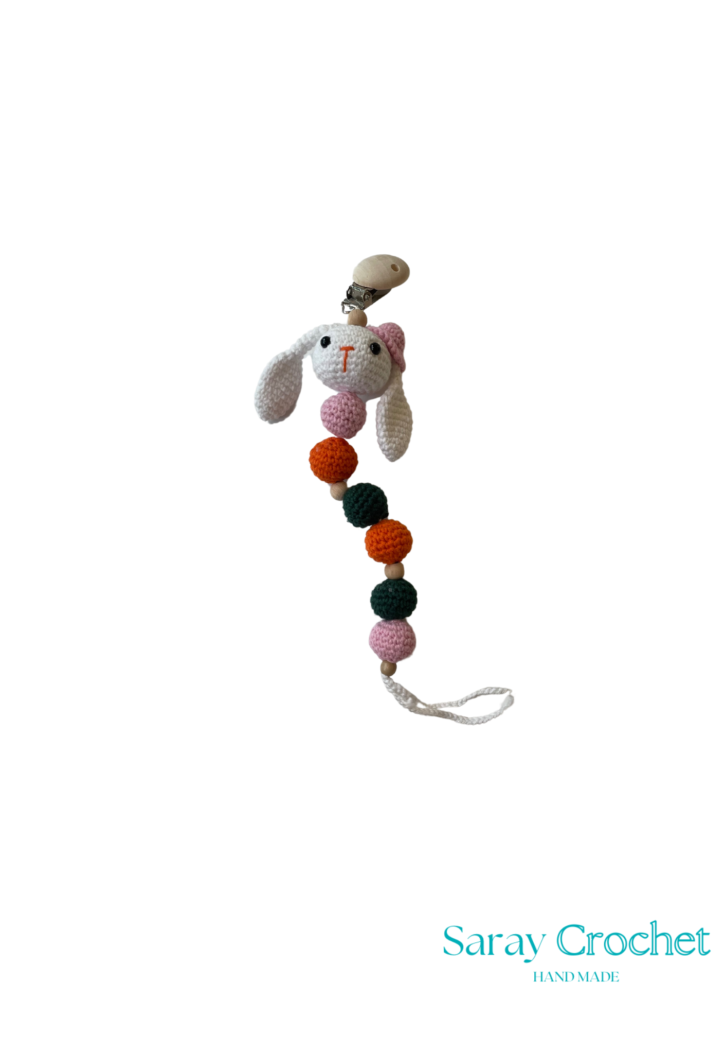Crocheted bunny with colorful pom-poms on a white background, branded 'Saray Crochet'.