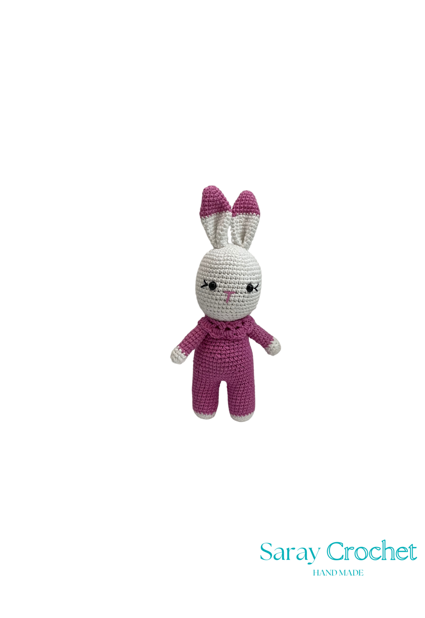 Crocheted rabbit toy with purple ears and pink body on a white background