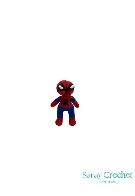 A small plush toy resembling Spider-Man, with a red and blue costume, against a white background with the text 'Saray Crochet' at the bottom.