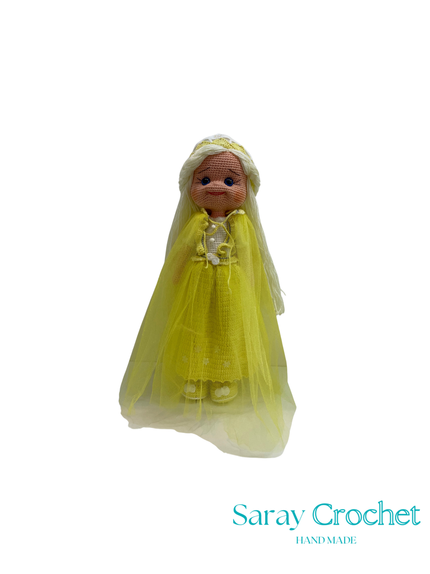 Toy doll with a yellow outfit on a white background, branded 'Saray Crochet'.