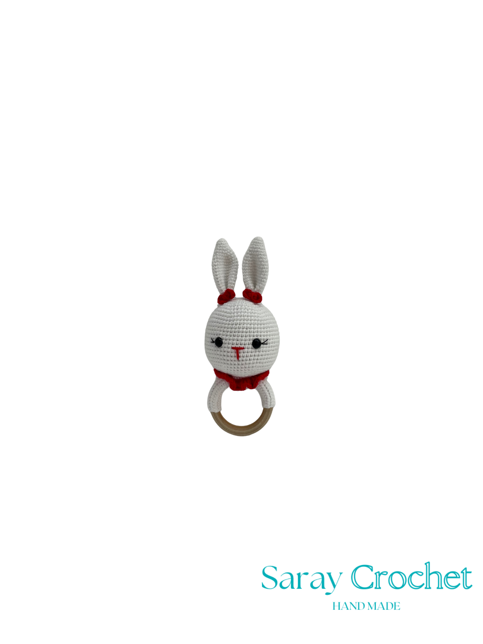 Crocheted rabbit rattle with a wooden ring on a white background, branded 'Saray Crochet'.