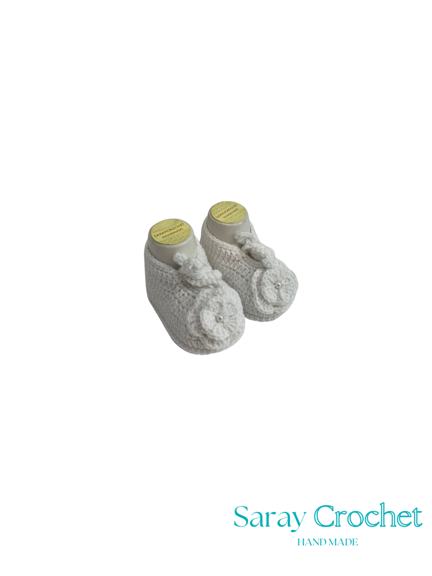 Pair of gray crocheted baby booties on a white background with 'Saray Crochet' branding.