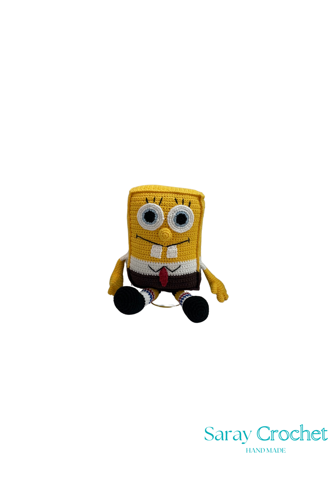 Handmade plush toy resembling a cartoon character with a yellow body, a red tie, and a square shape, under the brand name Saray Crochet.