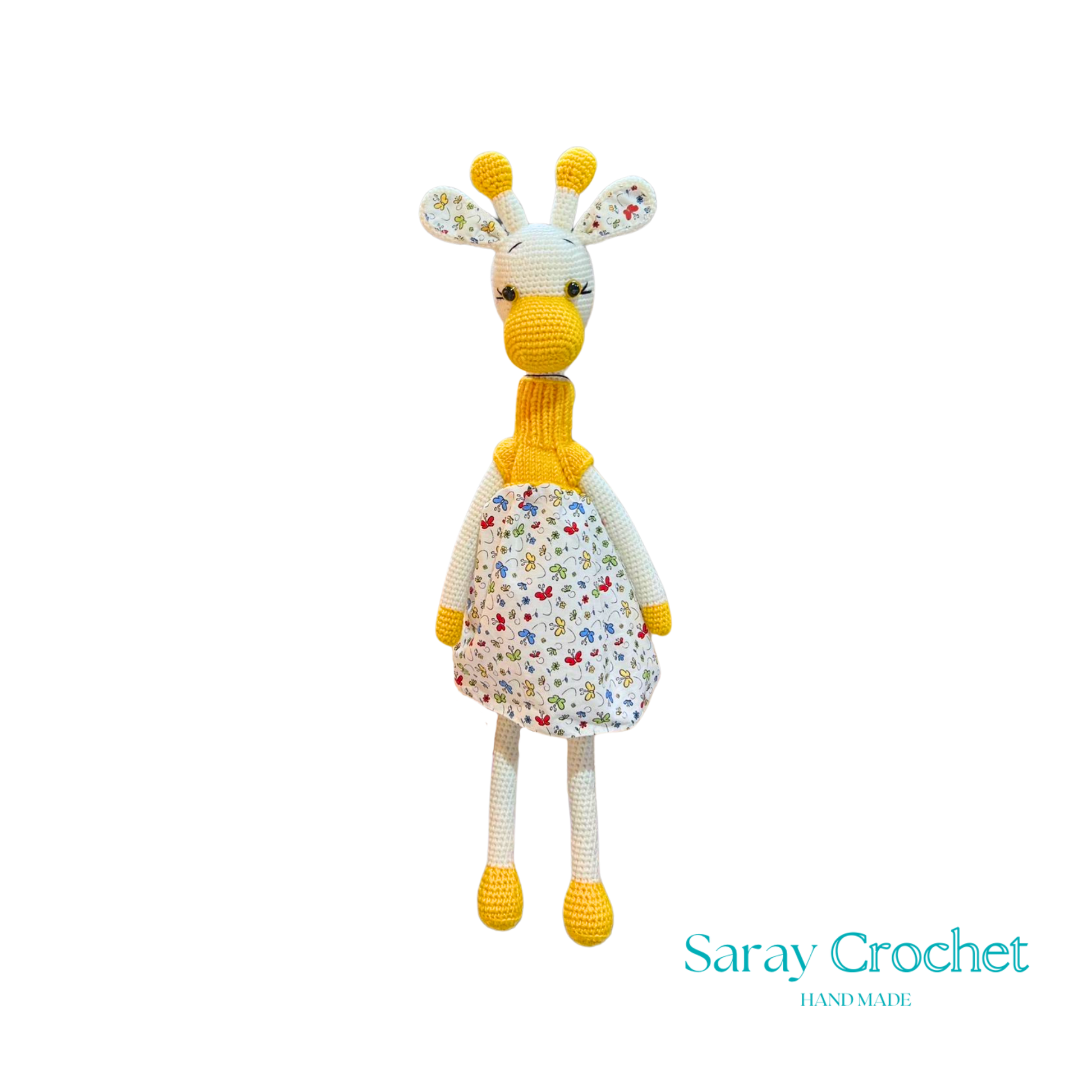 Handmade plush giraffe toy with a floral dress and a friendly face, part of the SarayCrochet collection.