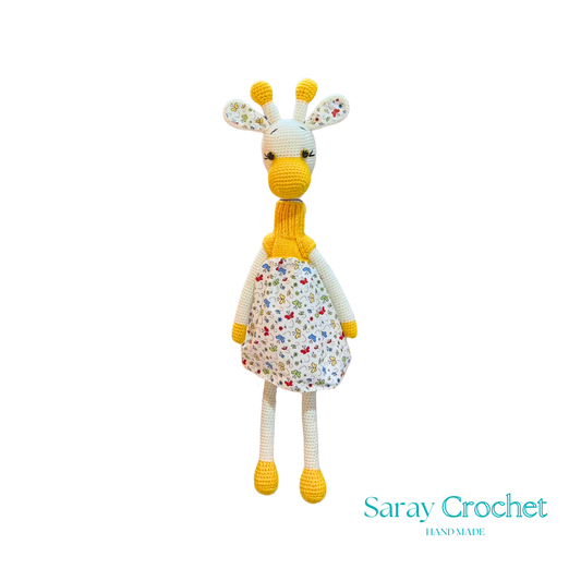 Handmade plush giraffe toy with a floral dress and a friendly face, part of the SarayCrochet collection.