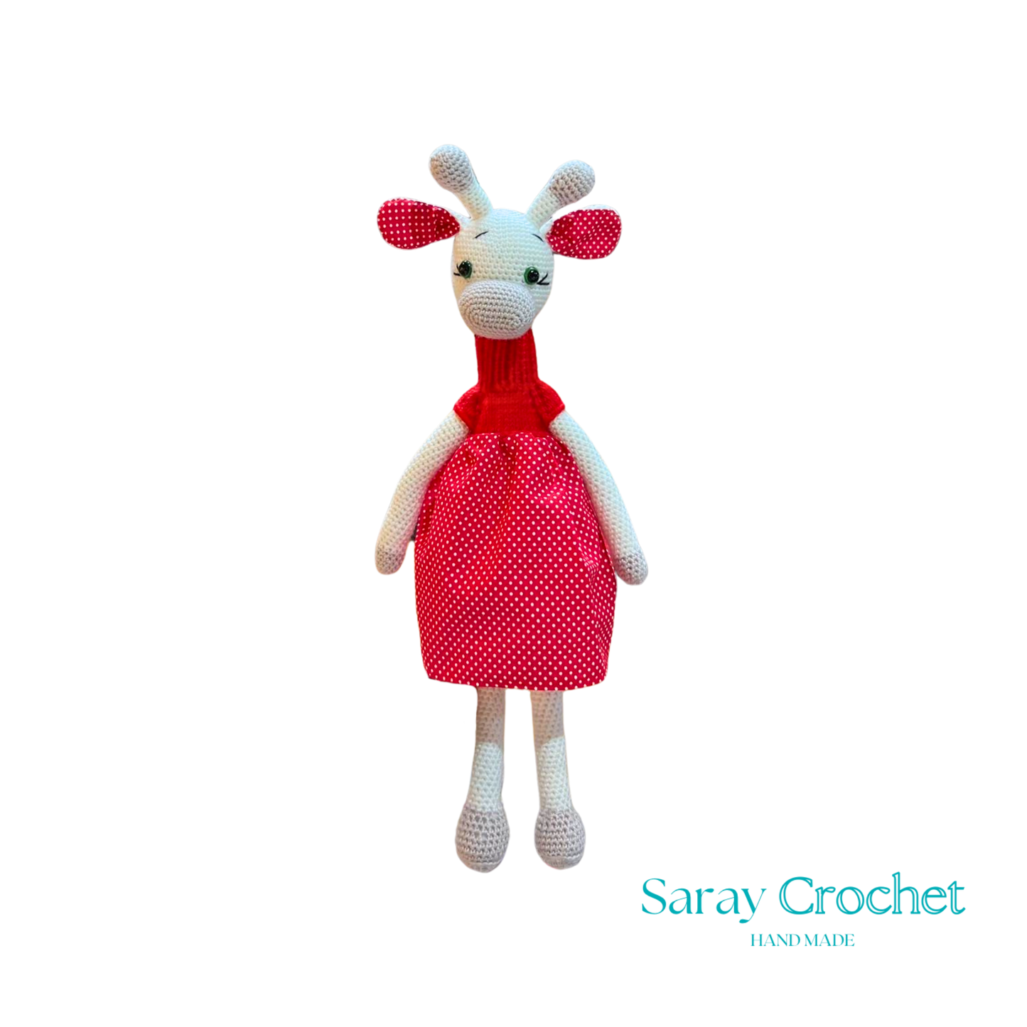 Handmade plush giraffe toy with a red dress and white body, standing upright.