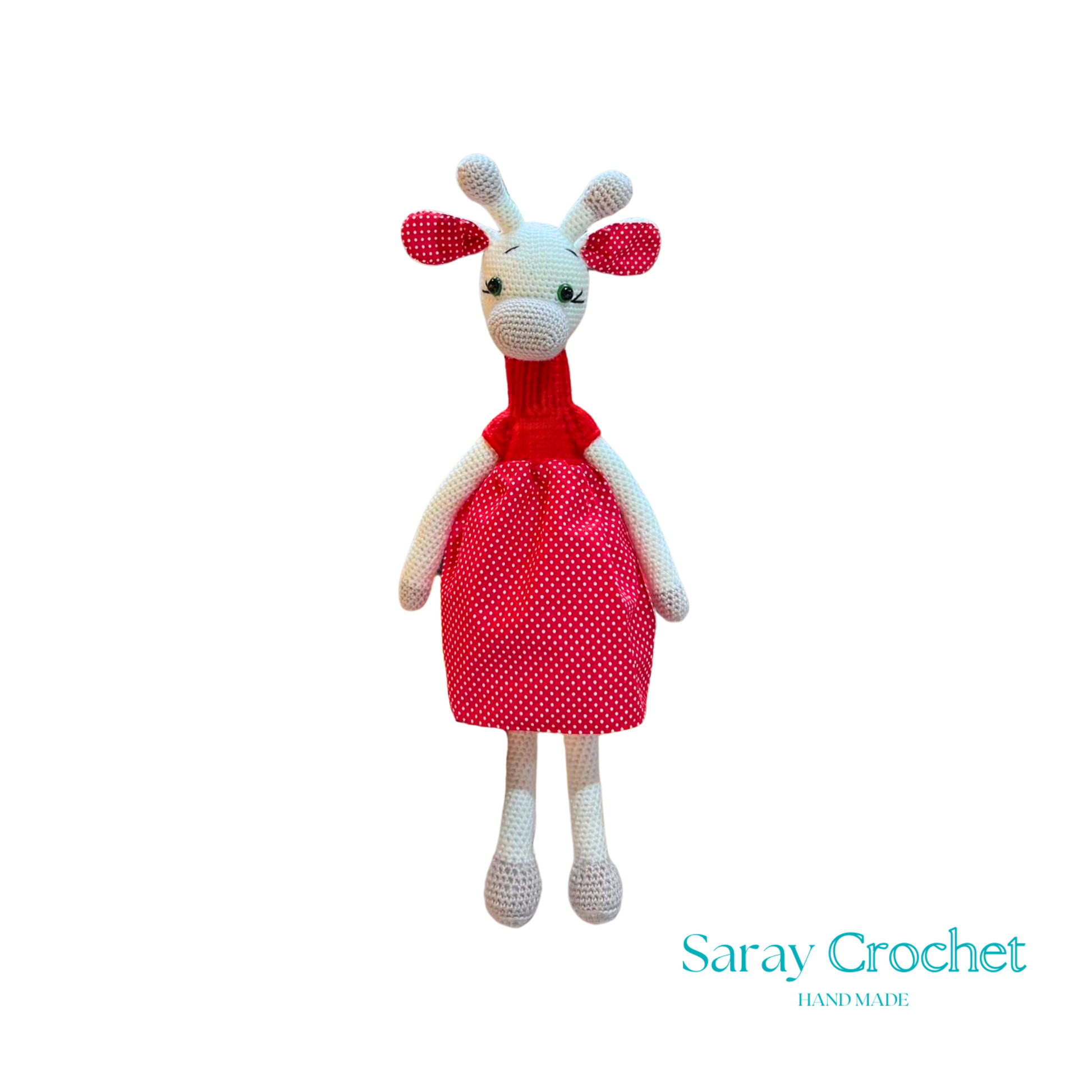 Handmade plush giraffe toy with a red dress and white body, standing upright.