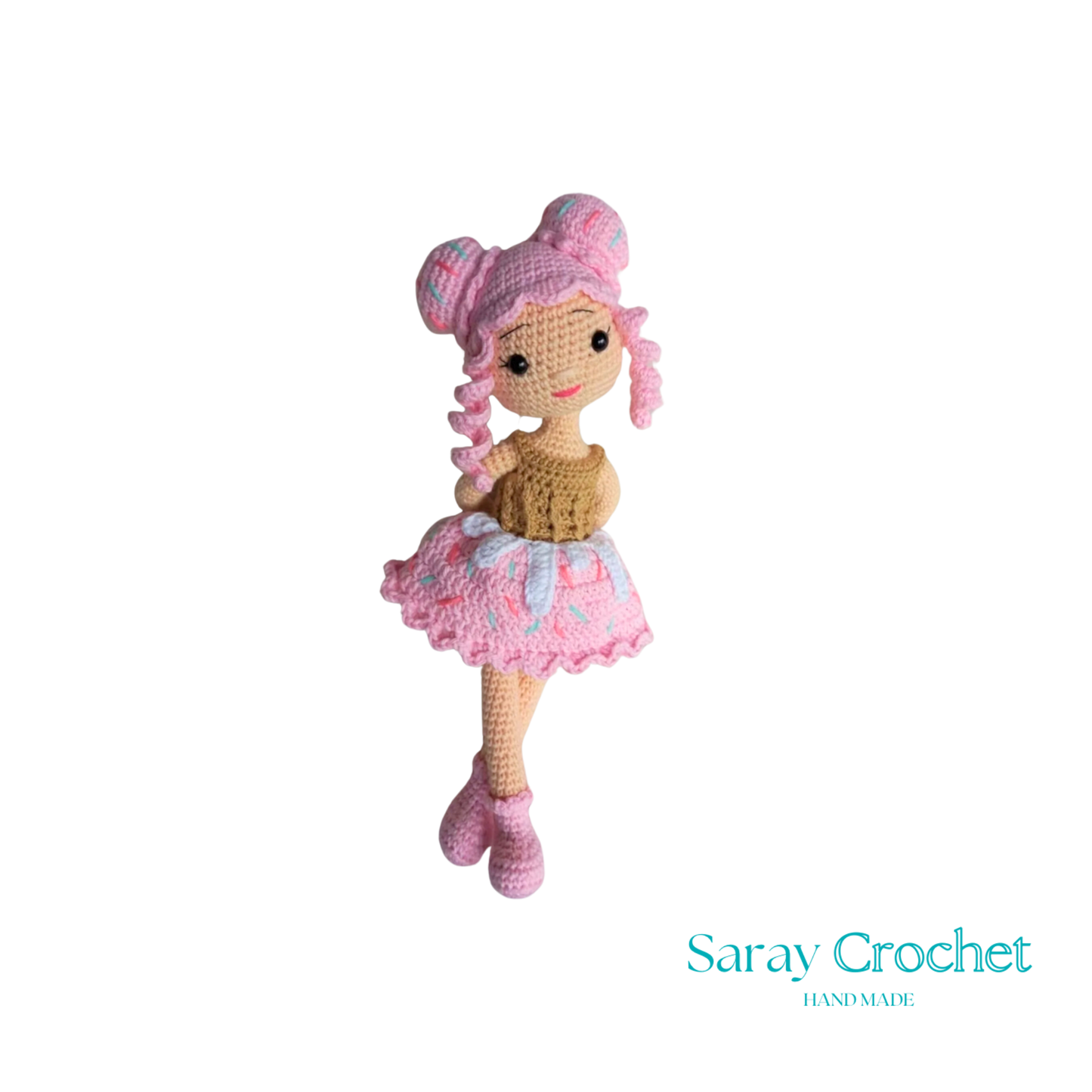 Handmade doll with a cupcake design, featuring a pink dress and matching hat.
