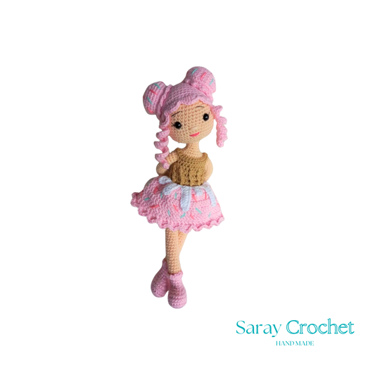 Handmade doll with a cupcake design, featuring a pink dress and matching hat.