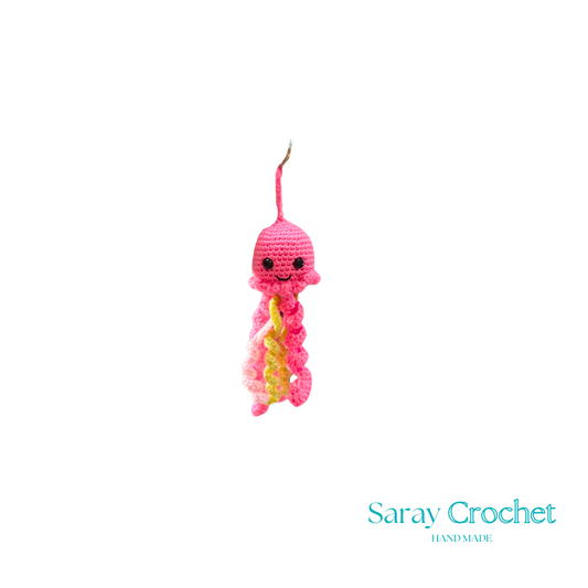 A pink and yellow octopus keychain with a heart-shaped top.