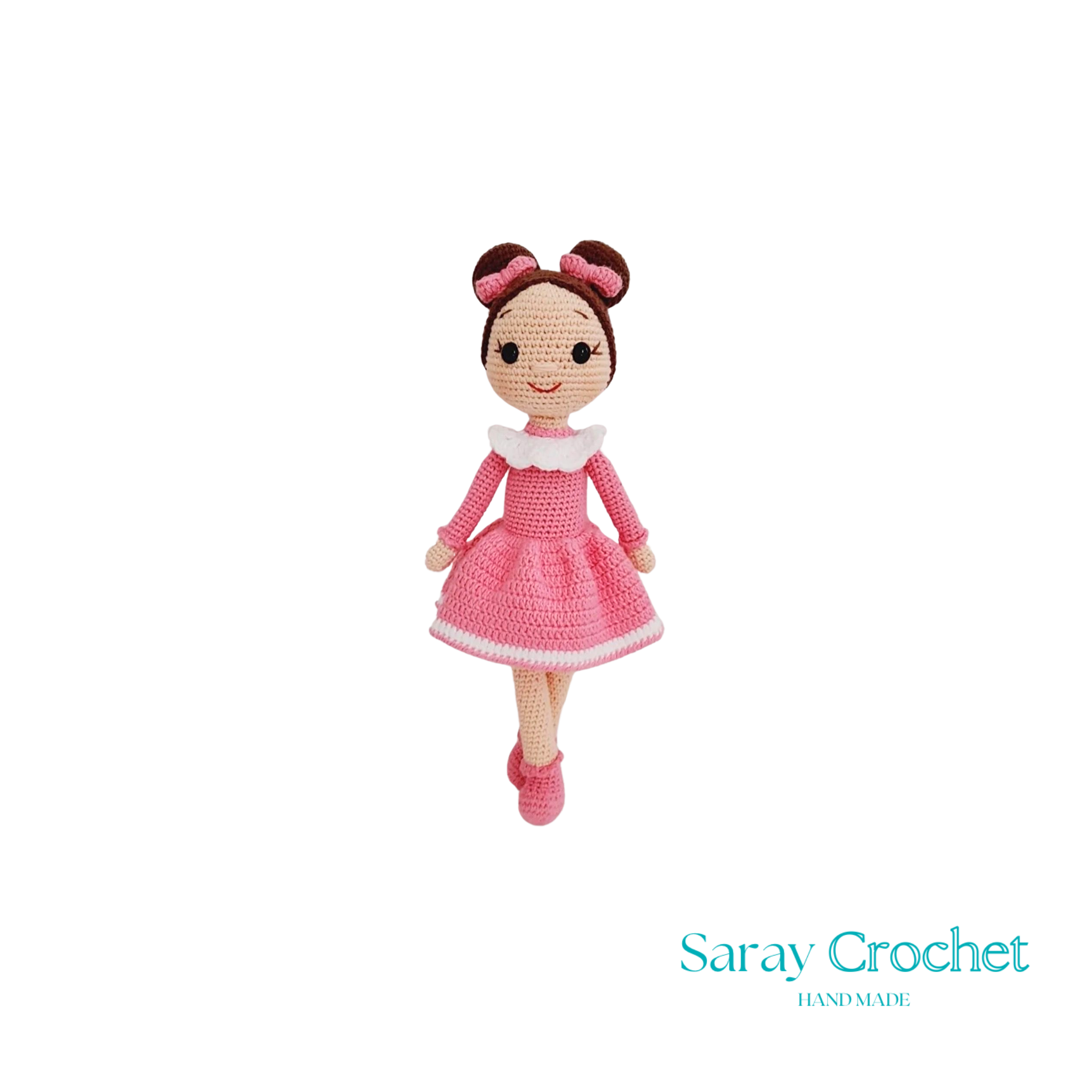 A handcrafted doll with a pink dress and bow, standing 30 cm tall.