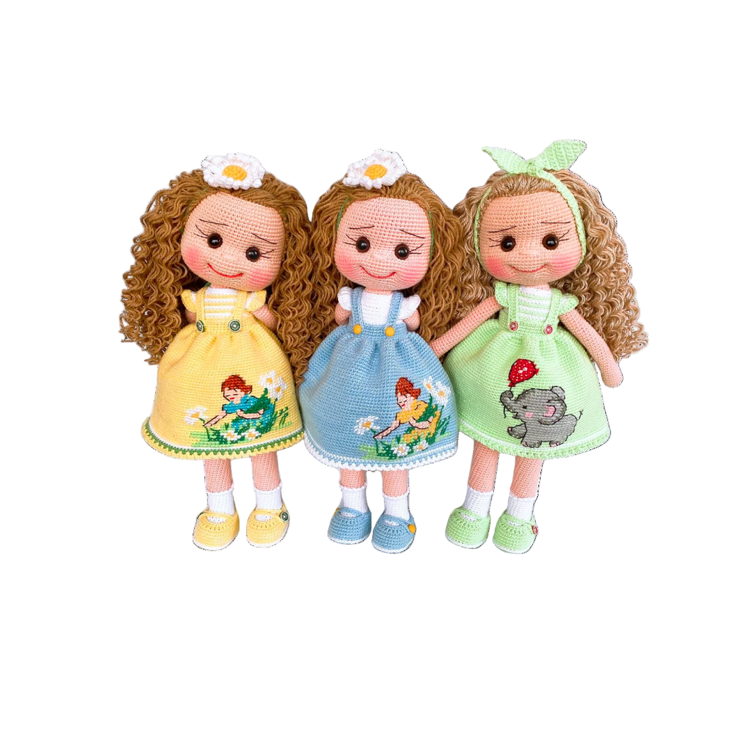 Three dolls with different colored dresses and designs on a white background