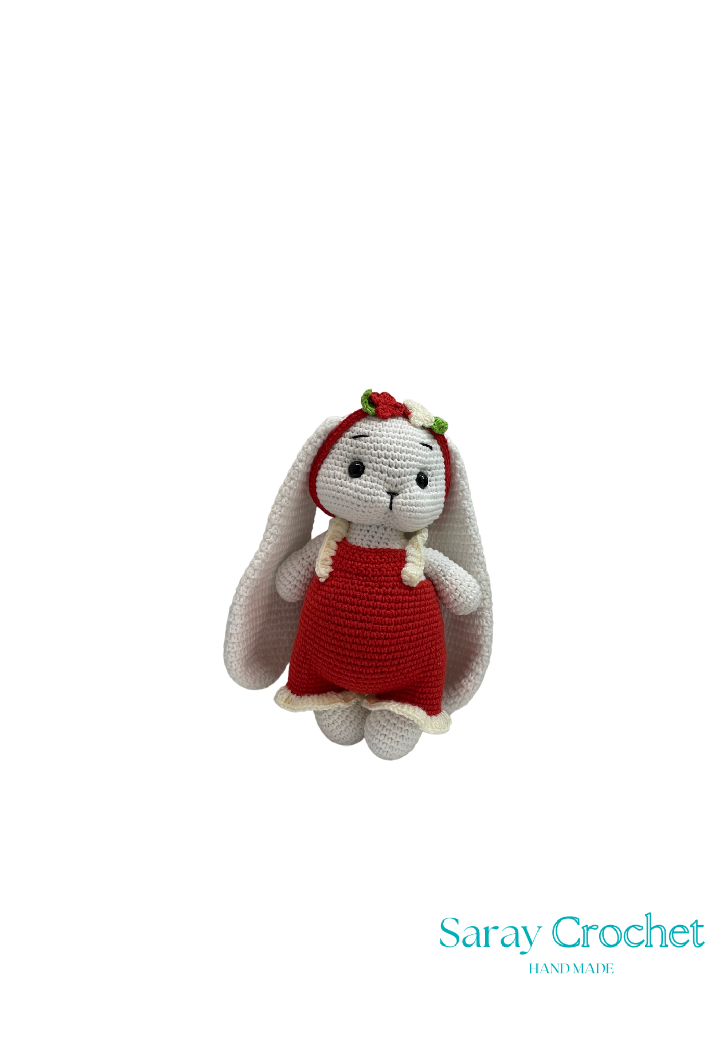 Crocheted rabbit toy in a red dress on a white background