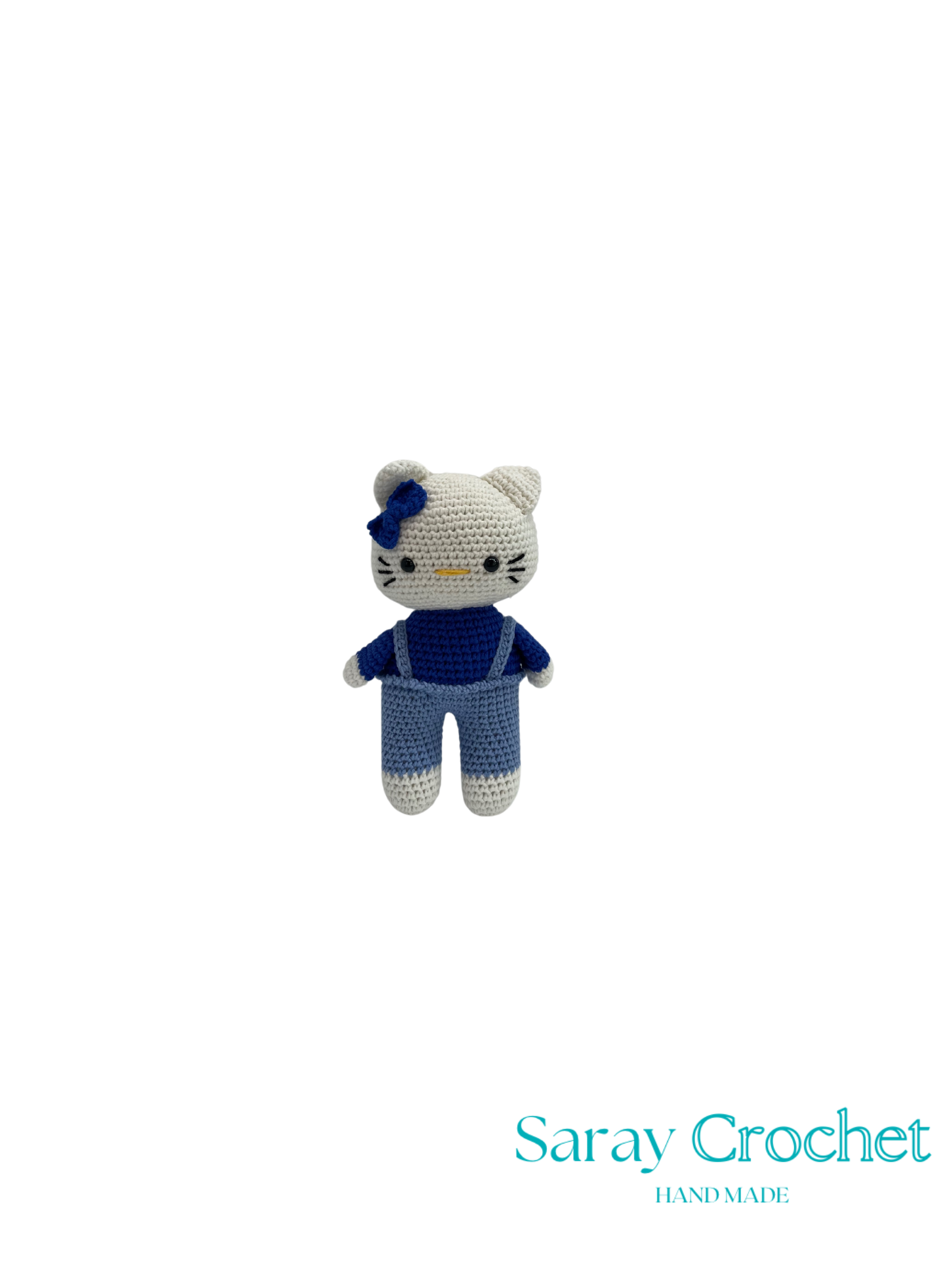 Crocheted toy resembling a cat character with a blue bow on a white background, branded 'Saray Crochet'.