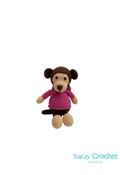 Crocheted monkey toy wearing a pink sweater on a white background with 'Saray Crochet' branding.