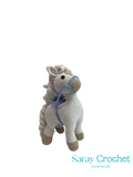 Crocheted horse toy with a blue bridle on a white background, branded 'Saray Crochet'.