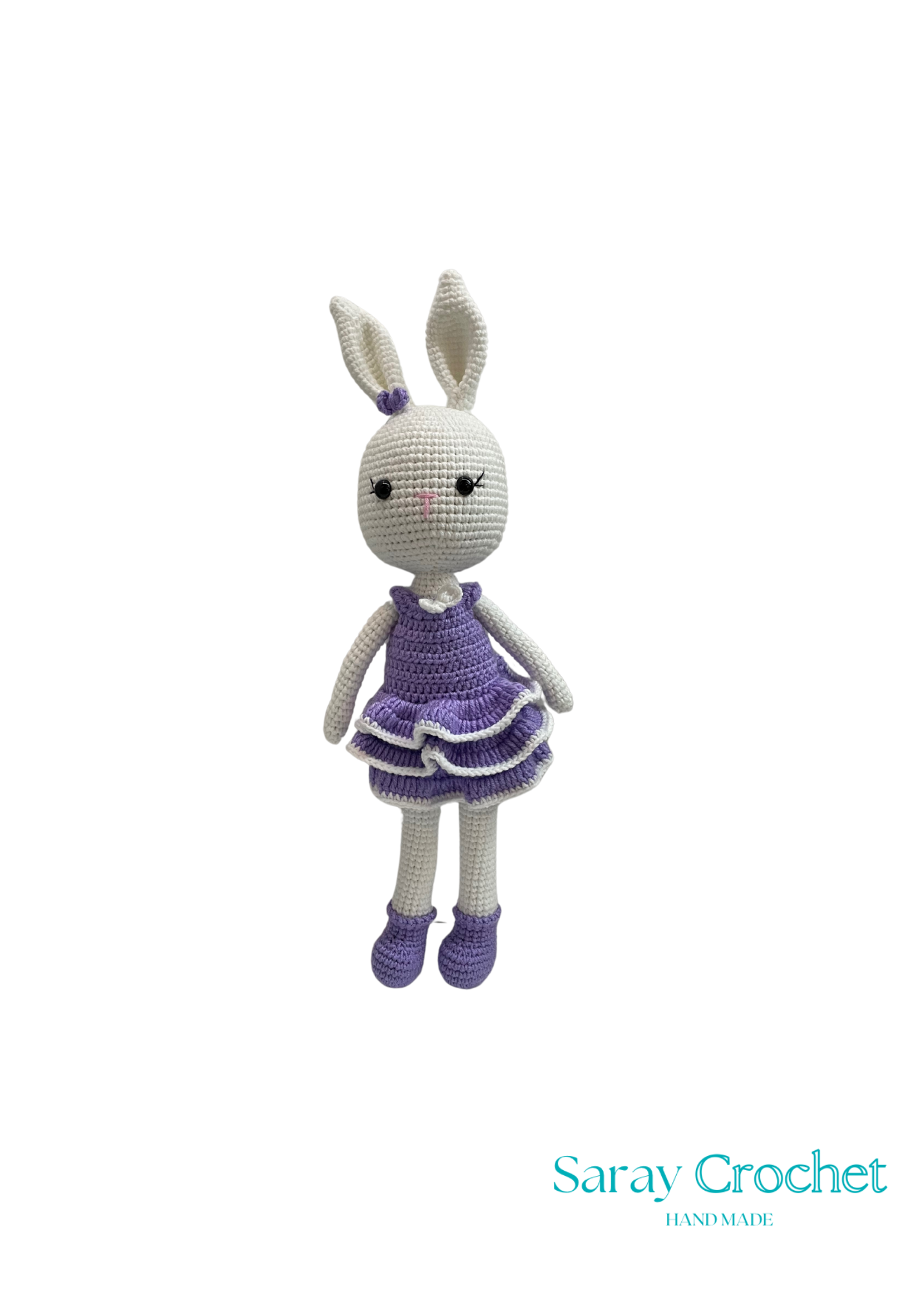 Crocheted bunny toy with a purple dress on a white background, branded 'Saray Crochet'.