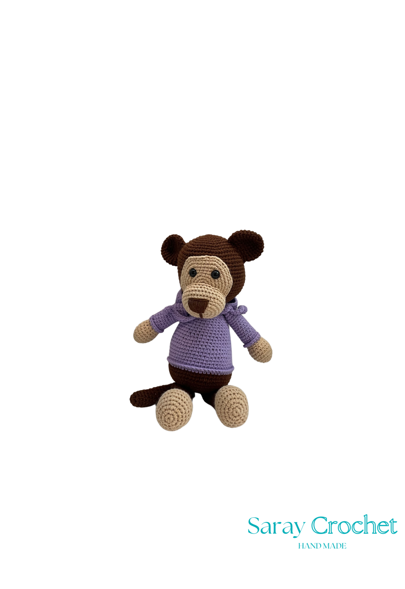 Crocheted monkey toy wearing a purple sweater on a white background with 'Saray Crochet' branding.