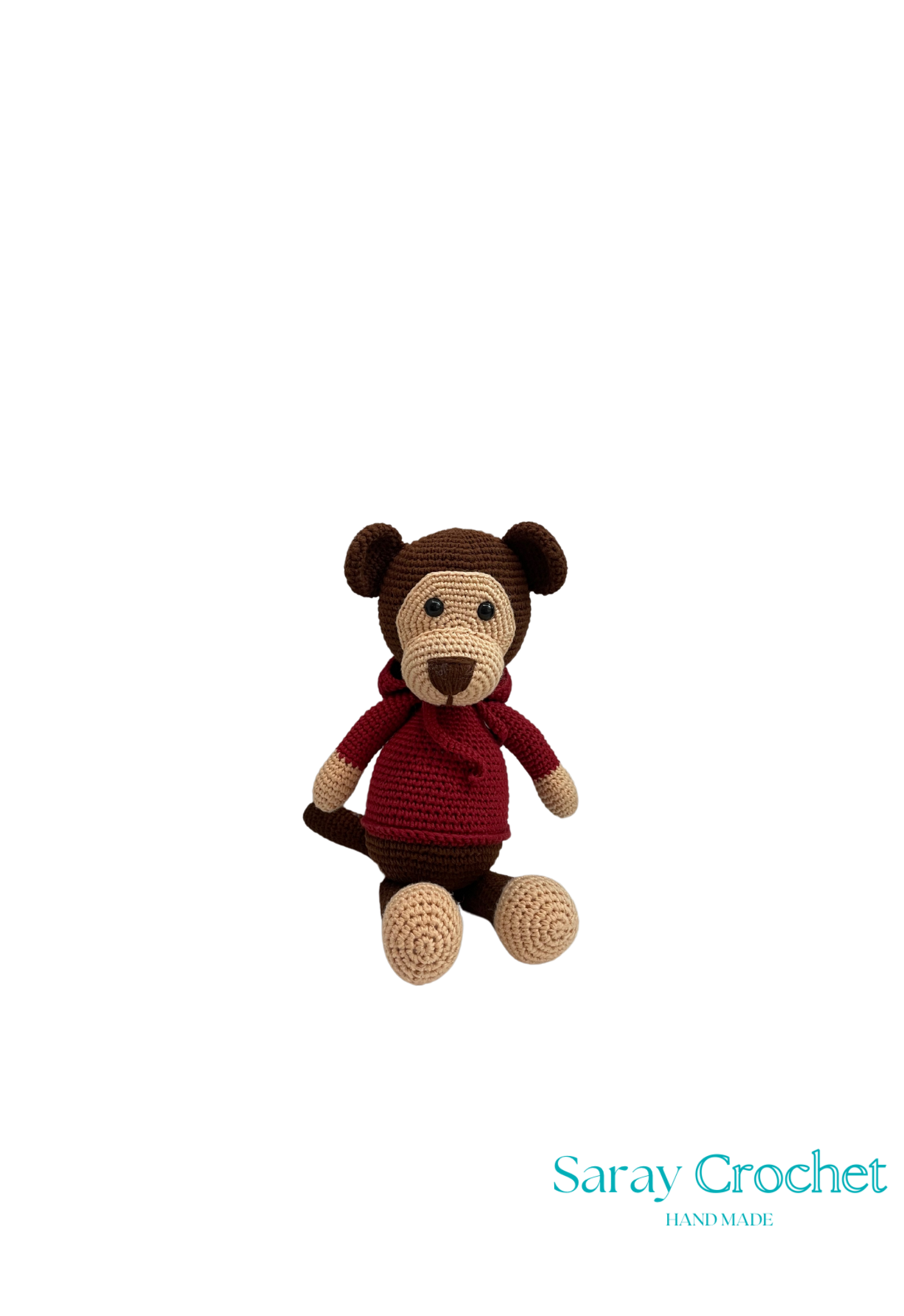Crocheted monkey toy with a red sweater on a white background, branded 'Saray Crochet'.