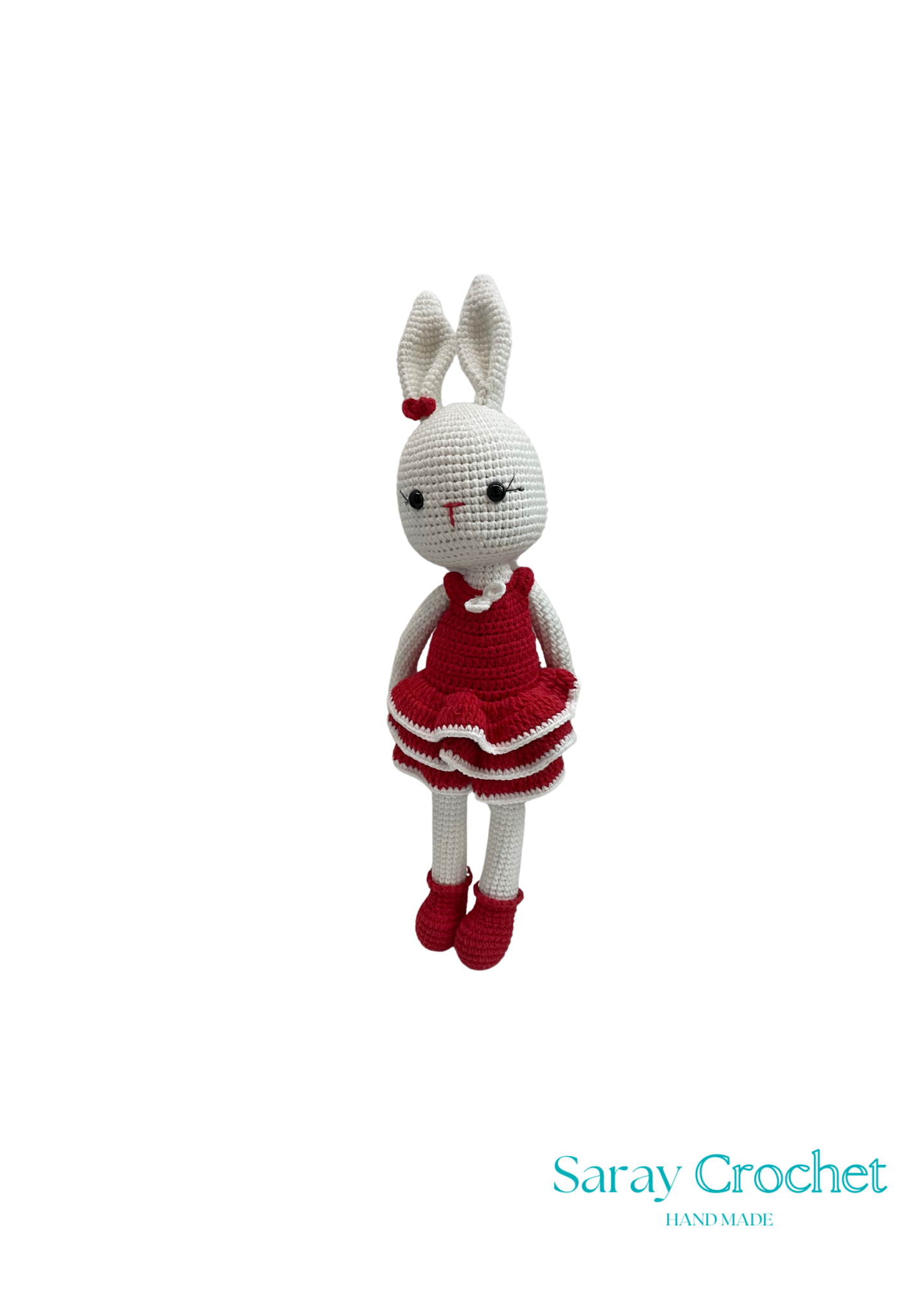 Crocheted bunny toy in a red dress with 'Saray Crochet' branding.