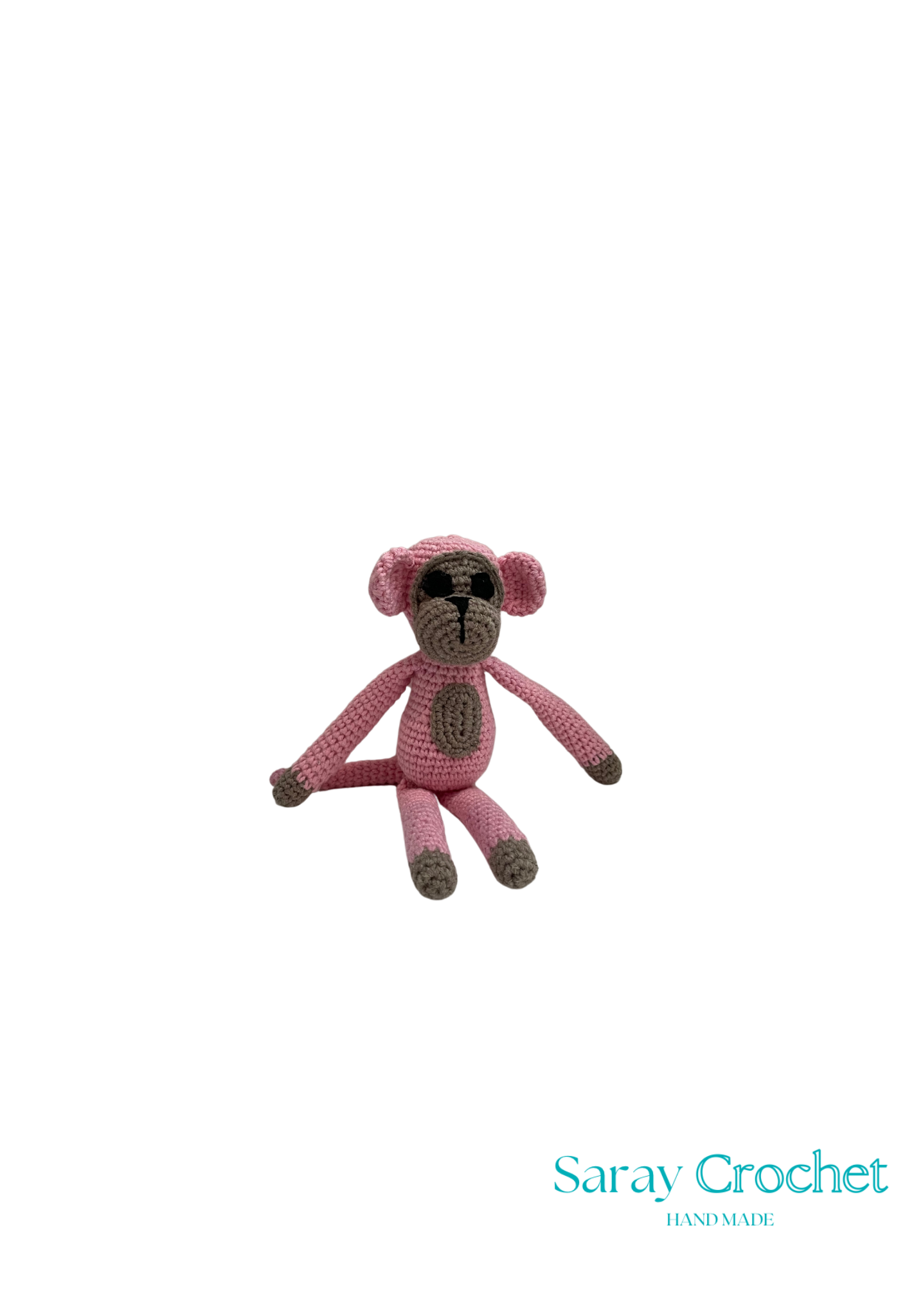 Pink crochet monkey toy on a white background with 'Saray Crochet' branding.