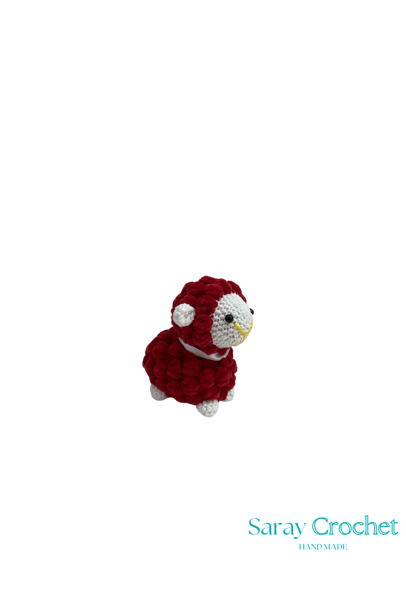 A crochet stuffed toy sheep in red and white, with the brand name 'Saray Crochet' visible.