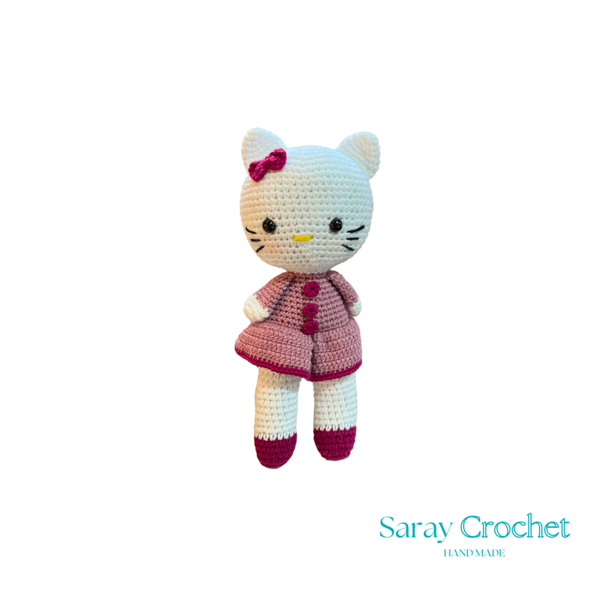 Crocheted cat toy with a pink dress on a white background, branded 'Saray Crochet'.