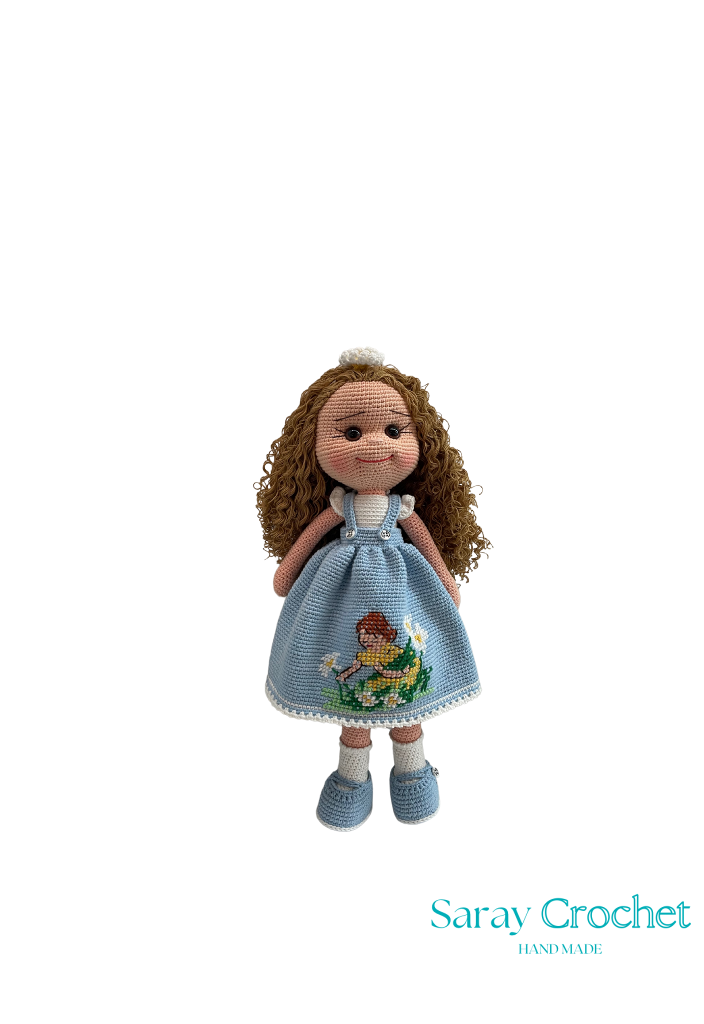 Handmade doll with a blue dress featuring a baby holding a white flower motif, and a white sash in its curly hair.