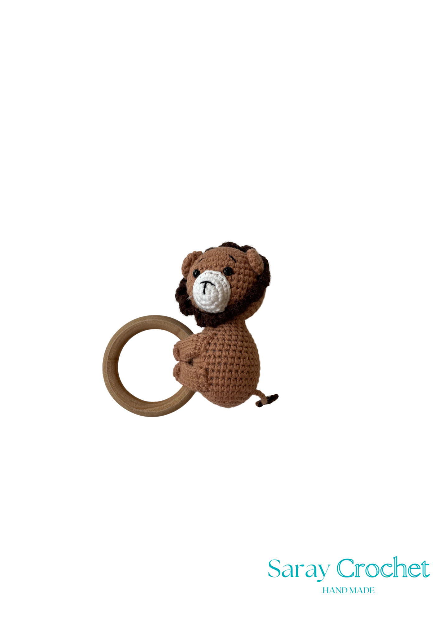 A crochet toy in the shape of a brown monkey sitting on a yellow ring, with the brand name 'Saray Crochet' written at the bottom.