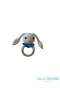 A crochet pattern for a gray and blue teething ring with a rabbit design.