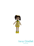 Handmade crochet doll with a yellow dress on a white background, branded 'Saray Crochet'.