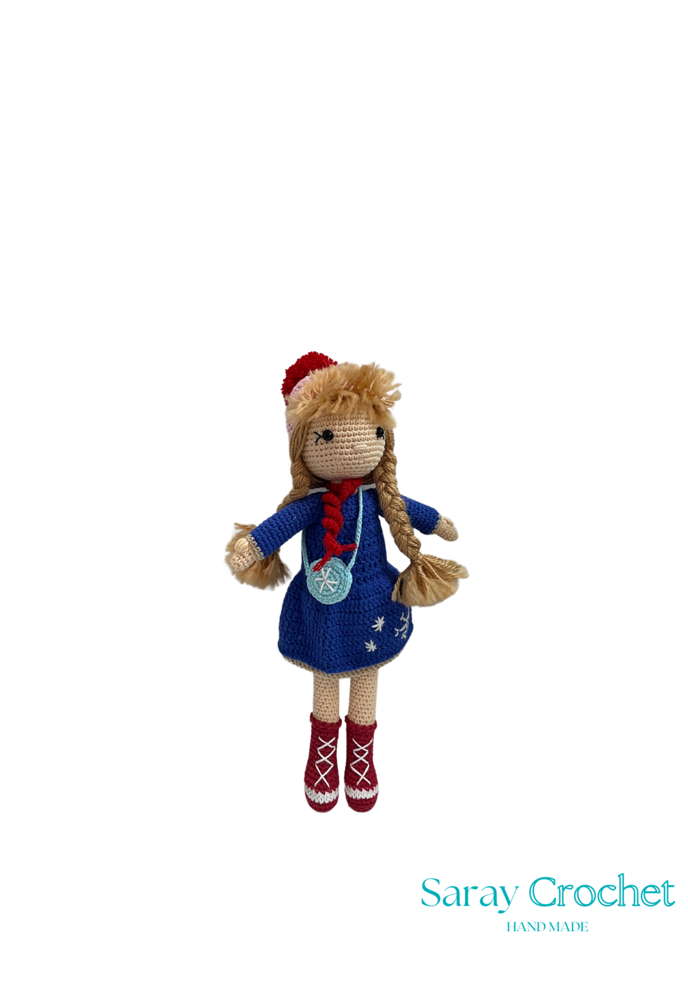 Handmade doll with a blue dress and red accents, wearing a crown and boots, standing against a white background with 'Saray Crochet' text.