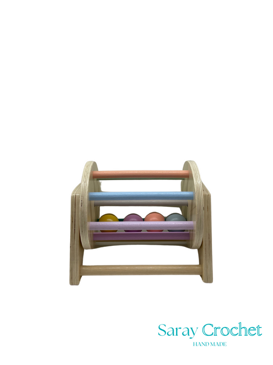 Wooden toy with colorful beads on a white background, branded 'Saray Crochet'.
