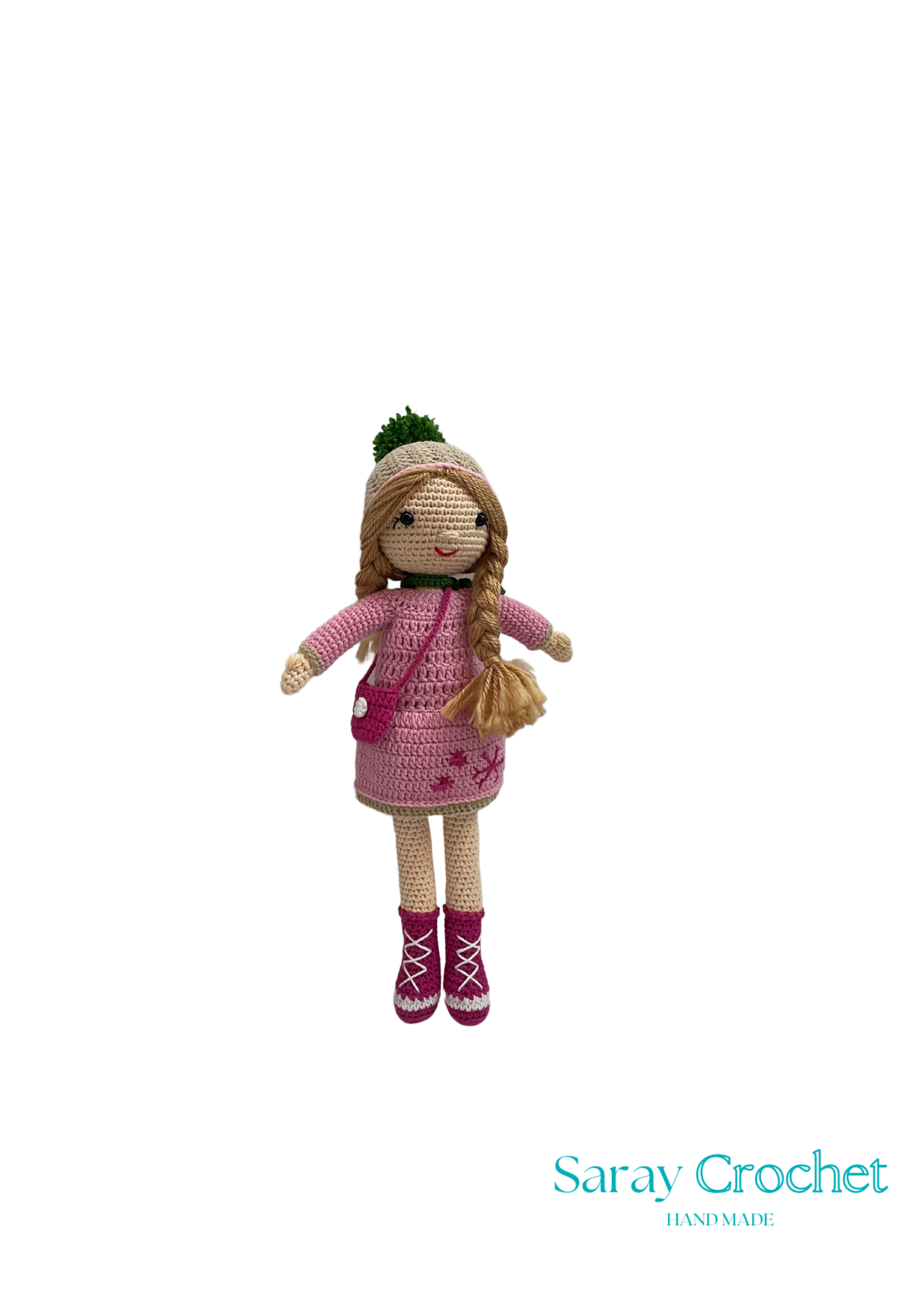 Handmade doll with a pink coat and winter details, standing against a white background with the text 'Saray Crochet'.
