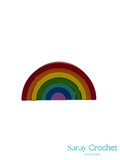 Colorful rainbow-shaped object with 'Saray Crochet' branding on a white background
