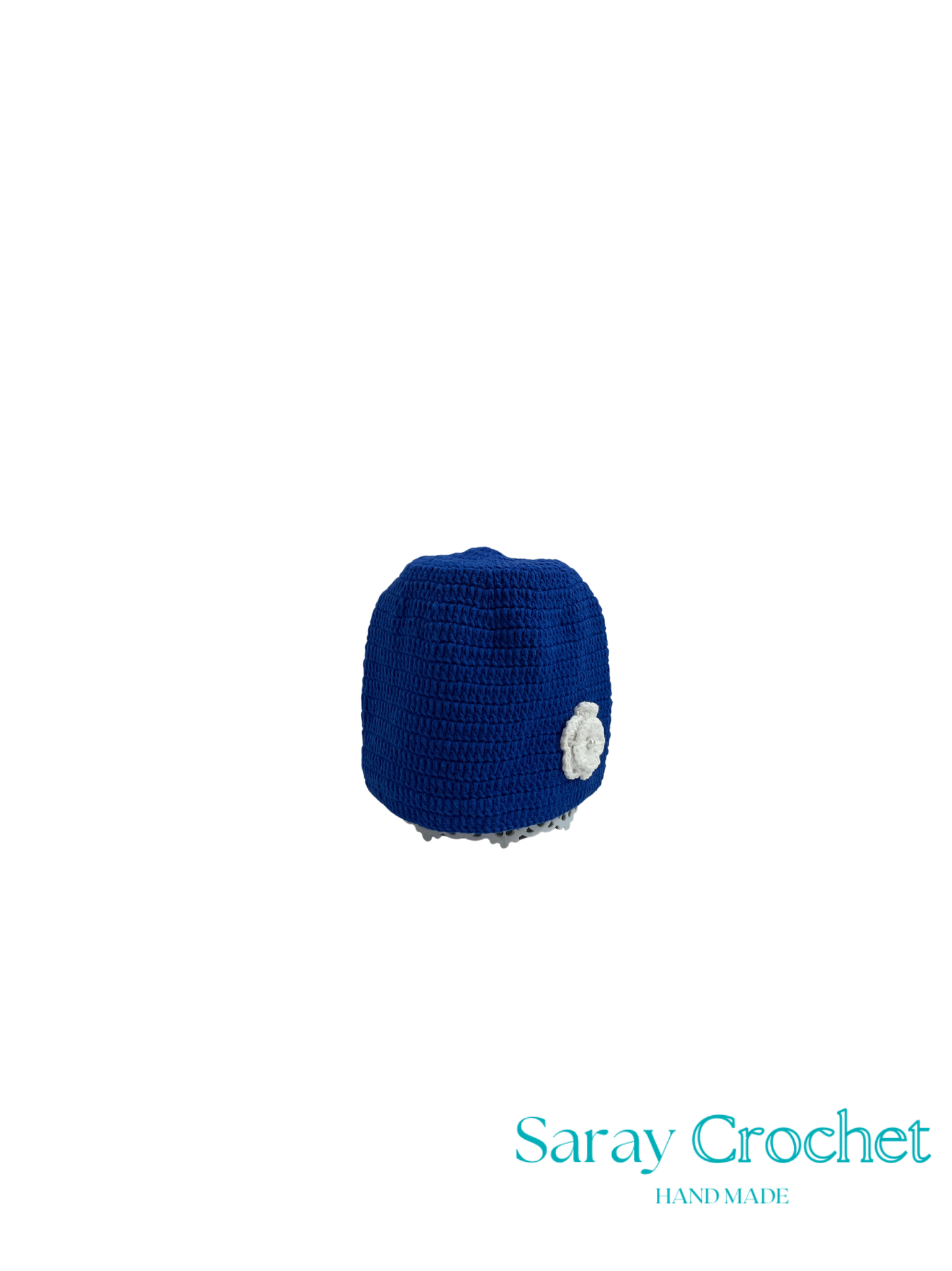Blue crocheted item with a white flower on a white background, branded 'Saray Crochet'.