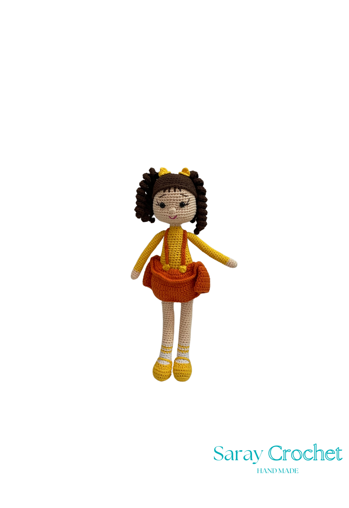 Handmade doll with a orange dress and yellow shoes, sitting upright with a crown on her head, made by SarayCrochet.