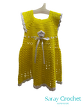 Yellow crochet dress with white trim on a mannequin against a white background, branded 'Saray Crochet'.