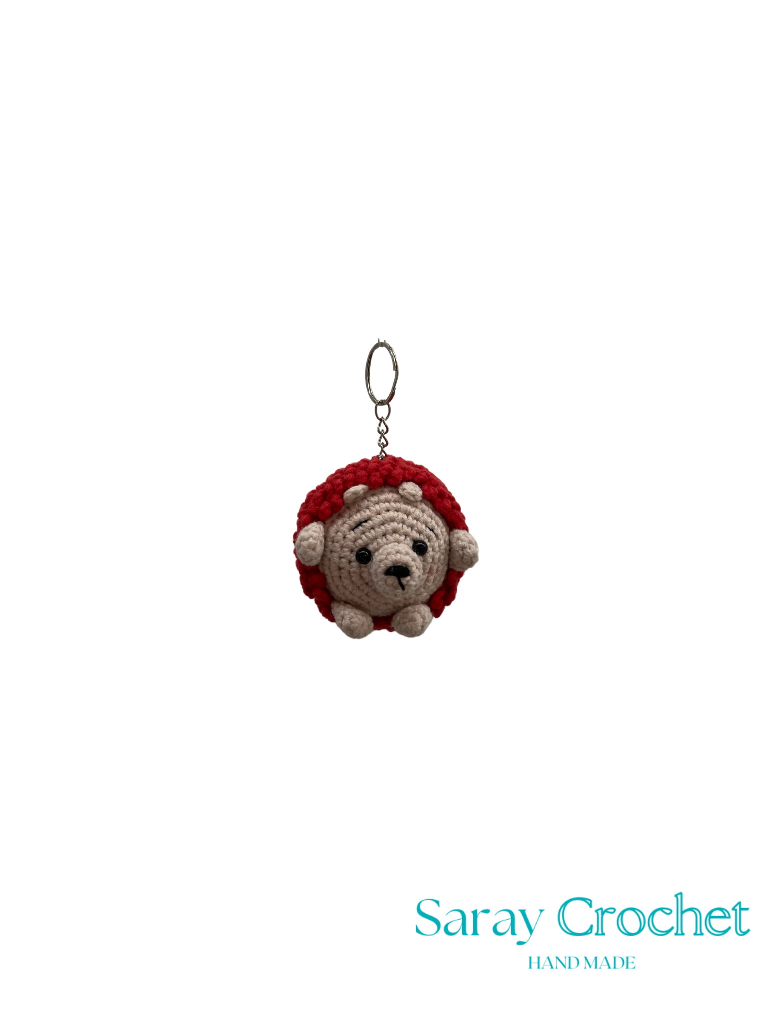 Crocheted hedgehog keychain with red top on a white background, branded 'Saray Crochet'.