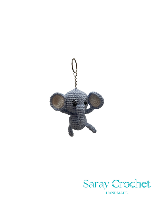 Crocheted elephant keychain on a white background with 'Saray Crochet' branding.