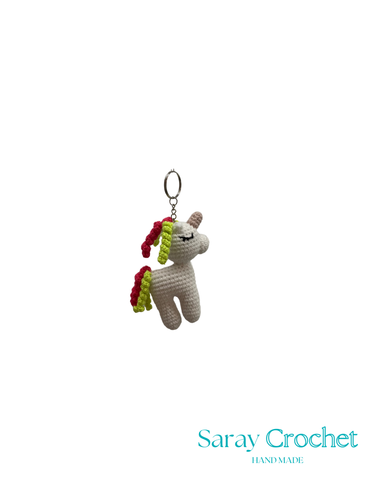 Crocheted unicorn keychain with colorful hair on a white background, branded 'Saray Crochet'.