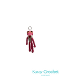 Pink crochet keychain with a hook on a white background, branded 'Saray Crochet'.