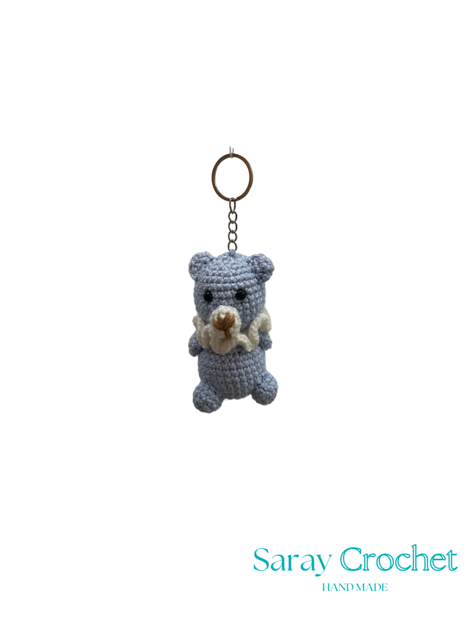 Crocheted bear keychain with a gold ring on a white background, branded 'Saray Crochet'.