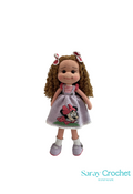 Handmade doll with a pink dress featuring a Mini Maus character, two bows on the hair, and white shoes.