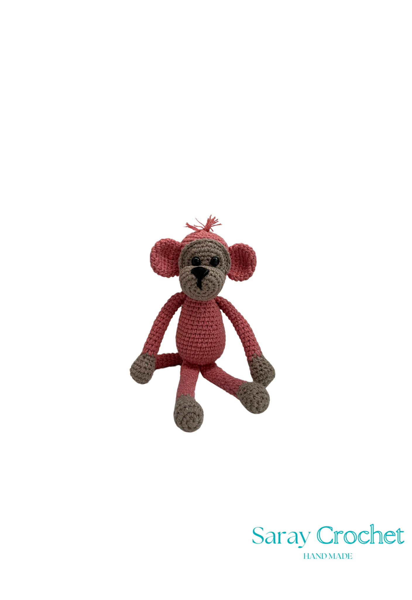 Handmade plush toy resembling a monkey with a red and gray color scheme, sitting upright, with a label indicating 'Saray Crochet'.