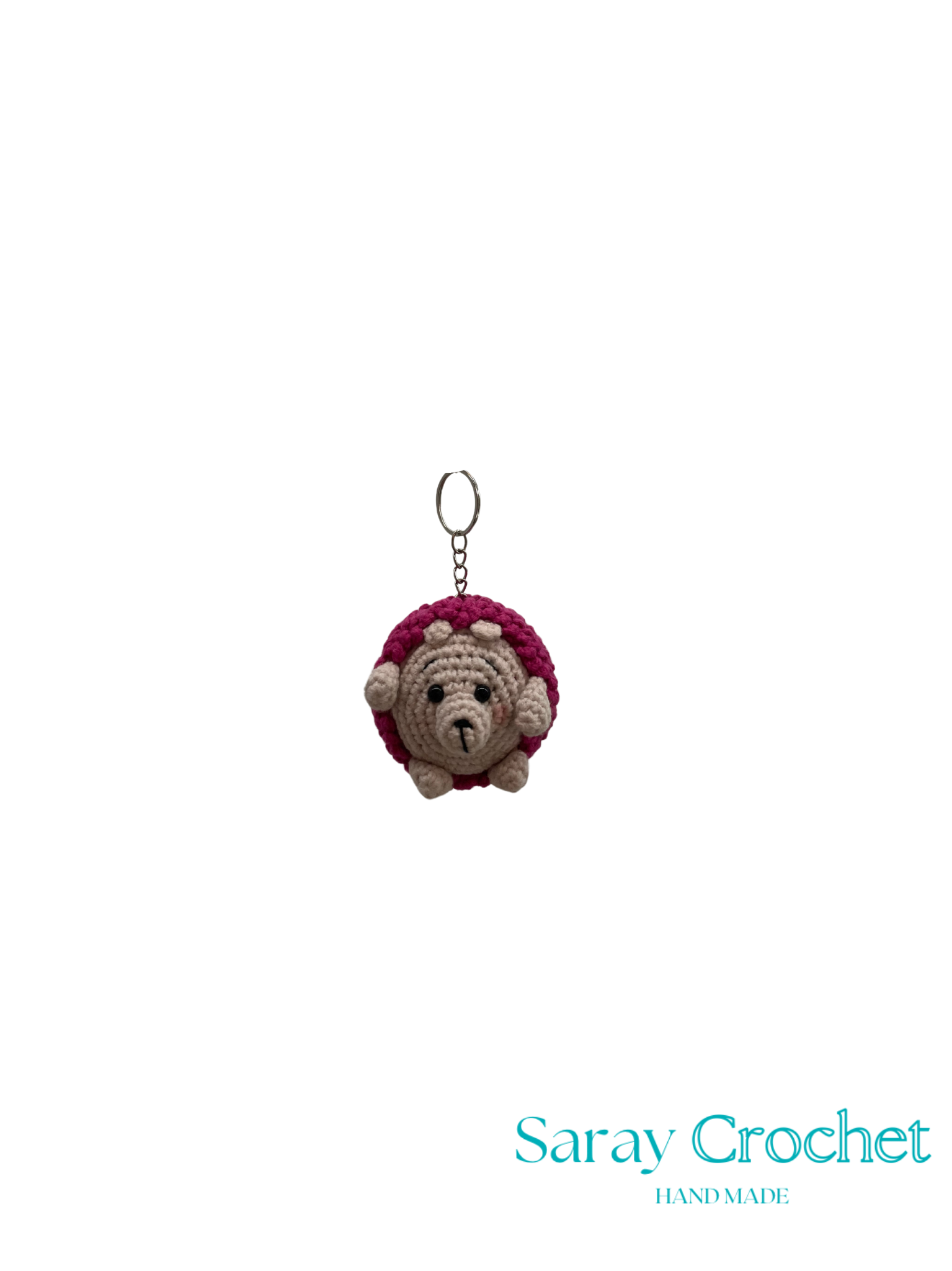 Crocheted hedgehog keychain with a pink top on a white background, branded 'Saray Crochet'.
