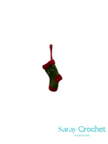 Knitted Christmas stocking with red trim on a white background, branded 'Saray Crochet'.